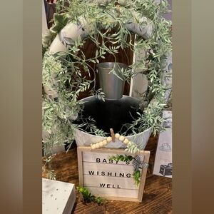 Handmade wishing well. White base with arch and greenery and pail.